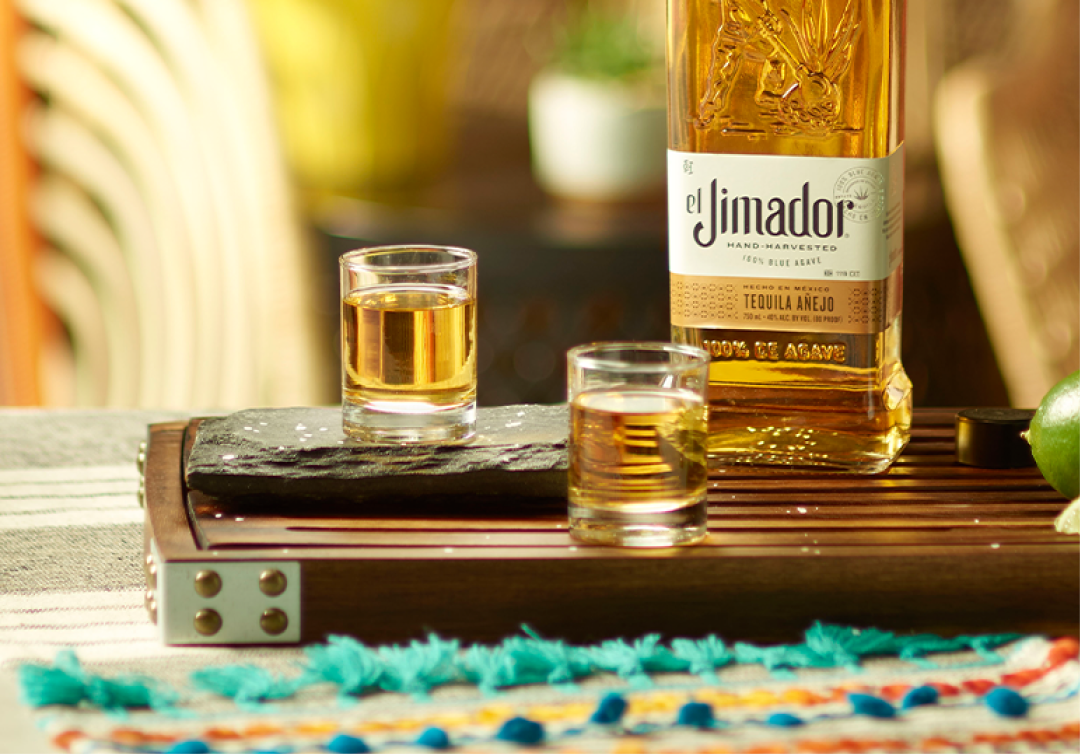 el Jimador Anejo in two shot glasses and el Jimador Anejo bottle.