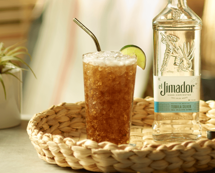 el Jimador Batanga cocktail on a table with an el Jimador Silver bottle.